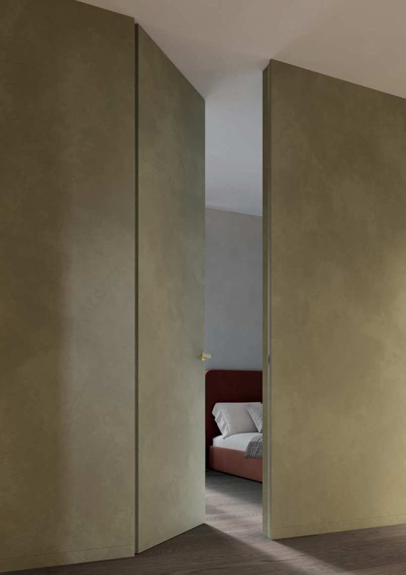 Boiserie con porte filomuro integrate e tutta altezza: creare lo “spazio invisibile” con le soluzioni Linear®